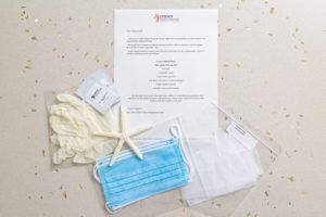 Crane's Stay Safely Kit with disposable masks, gloves, and hand sanitizer packets.